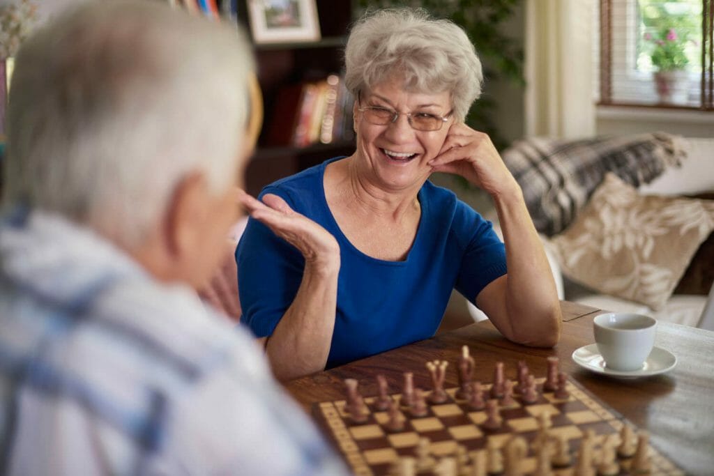 older couple playing chess